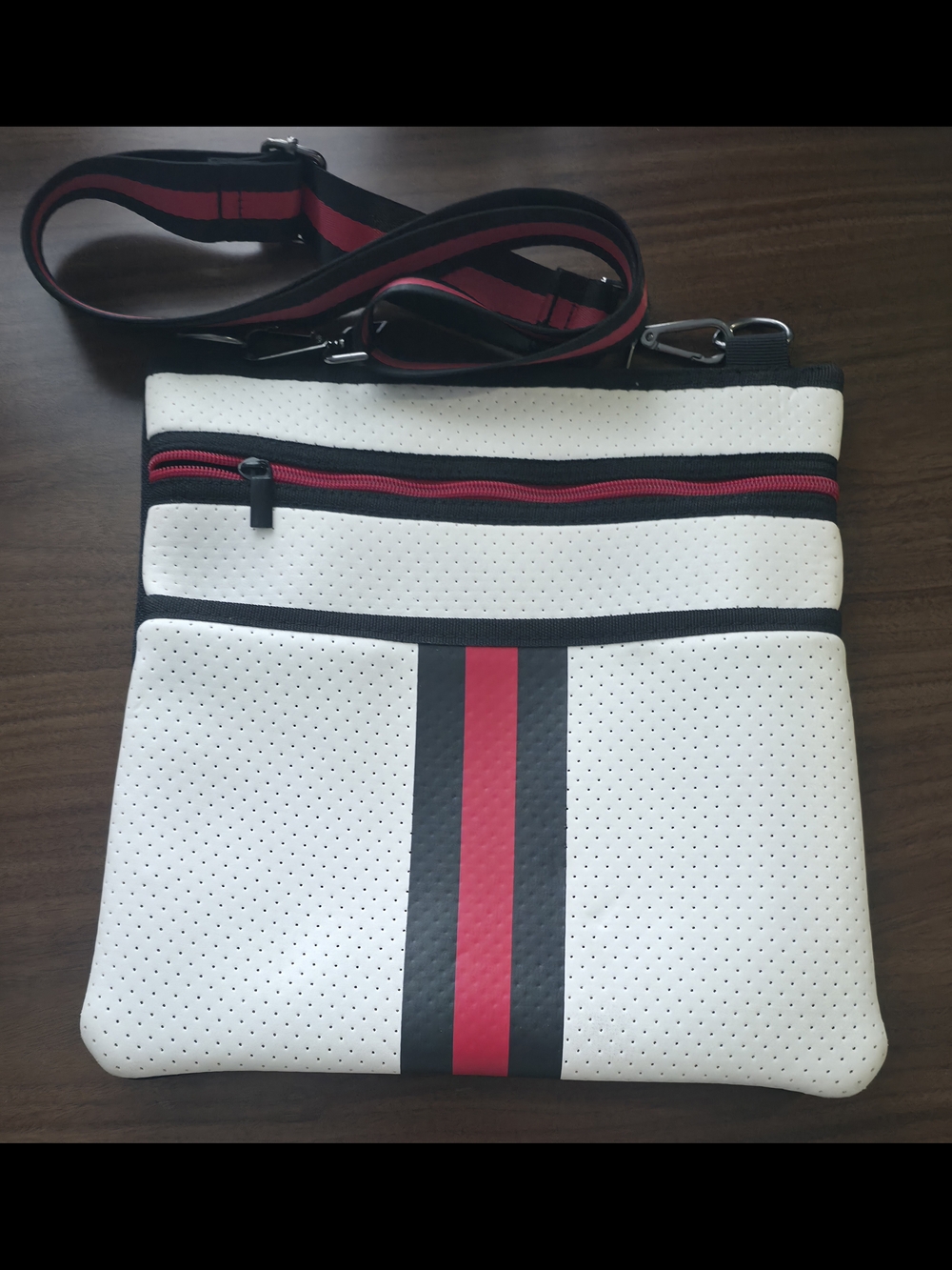 HAUTE SHORE White Crossbody Bag with Red and Black Stripes